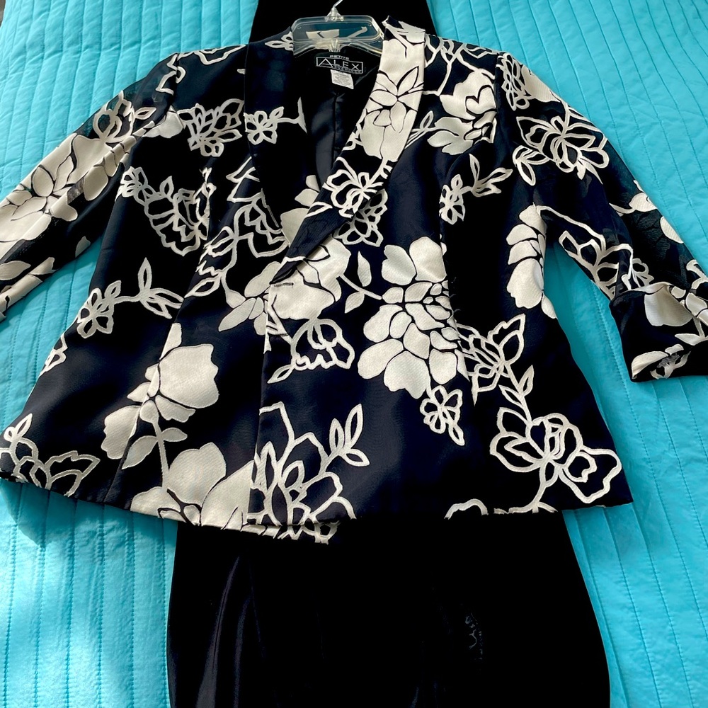 Dressy jacket and black pants.